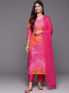 Elevate your style with our Pink and Orange Printed Kurta Set. Made from high-quality cotton, this set features a stunning bandhani print and intricate embroidery. The luxurious silk blend bottoms and dupatta add a touch of elegance to this traditional yet modern Indo-Western outfit. Perfect for any occasion. No. of pieces - 3 piece set. Color - Pink And Orange. Fabric - Cotton and Silk Blend. Washing Instructions - Dry Clean. Traditional Silk Palazzo Set With Bandhani Print, Pink Slub Silk Set For Navratri, Navratri Pink Slub Silk Sets, Multicolor Cotton Silk Palazzo Set With Dupatta, Multicolor Unstitched Cotton Silk Palazzo Set, Unstitched Multicolor Cotton Silk Palazzo Set, Designer Bandhani Print Palazzo Set For Navratri, Bollywood Style Multicolor Slub Silk Kurta, Multicolor Resham Embroidered Slub Silk Sets