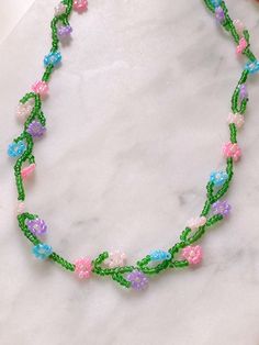 Spring Multicolor Beaded Flower Necklace, Beaded Flower Necklace For Spring, Handmade Flower Beaded Necklace For Spring, Spring Beaded Flower Necklace With Round Beads, Spring Flower Necklace With Colorful Round Beads, Spring Flower Necklace With Round Beads, Spring Beaded Flower Necklace, Colorful Beaded Necklaces For Spring, Colorful Round Beaded Necklaces For Spring