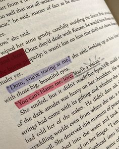 an open book with red and purple highlights on it's page, which is highlighted in the bottom left corner