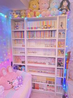 a room filled with lots of books and stuffed animals on top of the book shelves