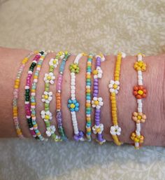 This listing is a collection of 10, spring-themed, dainty minimalistic beaded bracelets! Perfect for Easter and the whole spring season. Boho stackable bracelets strung on strong beading string, very durable making them perfect for everyday wear. A wonderful gift for someone or yourself! Each bracelet is sold separately and numbered in pictures 2 and 3 so you can make sure you're getting the right bracelet. They come in many sizes, and let me know if you don't see yours! All of our jewelry comes gift-wrapped in a little bag, making them the perfect gifts for best friends, gifts for her or to treat yourself! Or would be cute friendship bracelets! They ship very quickly! Spice up your jewelry collection with these beaded bracelets. If you have any questions or anything else feel free to cont Delicate White Bracelets For Spring, Delicate White Bracelet For Spring, White Delicate Bracelet For Spring, Spring Everyday Friendship Bracelets, Spring Friendship Bracelets For Everyday Wear, Everyday Beaded Bracelets For Spring, Spring Everyday Beaded Bracelets, Beaded Bracelets For Everyday Spring Wear, Spring Beaded Bracelets For Everyday