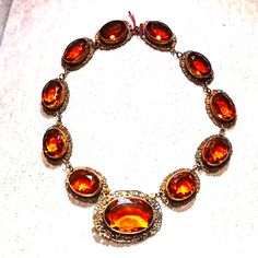 Gorgeous Antique Victorian Ornate Necklace With Amber Colored Glass Stones It Clips Onto The Front Larger Stone As Soon In Pictures. In Excellent Condition 16" No Chips Or Cracks. Luxury Amber Jewelry For Formal Occasions, Formal Cabochon Pendant Necklace, Luxury Jeweled Necklaces For Formal Occasions, Classic Formal Necklaces With Stones, Luxury Jeweled Necklace For Formal Occasions, Classic Formal Necklace With Stones, Orange Gemstone Jewelry For Formal Occasions, Elegant Evening Cabochon Necklaces, Formal Orange Gemstone Jewelry