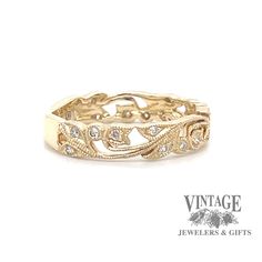 an 18k yellow gold wedding band with diamonds