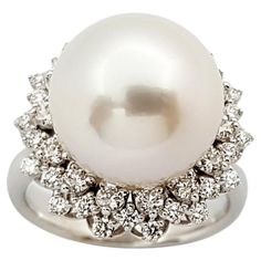 South Sea Pearl with Diamond 0.38 carat Ring set in 18 Karat White Gold Settings Width: 1.8 cm Length: 1.8 cm Ring Size: 51 Total Weight: 8.92 grams South Sea Pearl: 12.6 mm "We first opened doors in 1980 when it was then situated in the vicinity of the Victory Monument; a small and modest storefront with a couple of counters. From its humble beginnings to where it stands today, our company has proven its abilities as a jeweler. Since the beginning, we have been supplying fine quality pieces to Timeless White Gold Pearl Ring With Diamonds, Luxury Brilliant Cut Pearl Ring For Formal Occasions, Luxury Pearl Ring With Brilliant Cut For Formal Occasions, Luxury Pear-shaped Diamond Ring With 17 Jewels, White Gold Pearl Ring With Brilliant Cut For Anniversary, Luxury Formal Cluster Diamond Ring, Anniversary White Gold Pearl Ring With Brilliant Cut, Luxury White Platinum Cluster Ring, Diamond White Platinum Pearl Ring For Anniversary