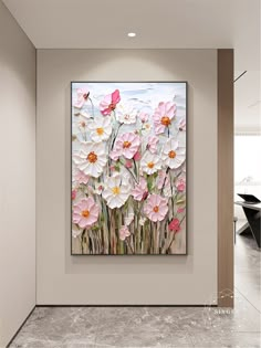 a painting on the wall with flowers in it