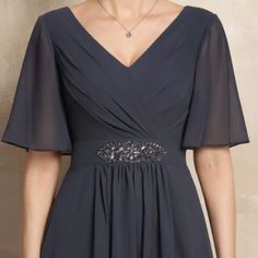 V-Neck Ankle-Length Chiffon Mother Of The Bride Dress With Ruffle Beading Sequins. Color: Steel Grey Built In Bra. Sleeve: 1/2 Sleeves Back Style: Zipper Up Size Bust (Inch) -- 45. Waist (Inch)-- 38 1/2. Hips (Inch)-- 47 1/2. Hollow To Hem(Front) (Inch) -- 56. Smoke Free And Animal Free Home. Dress Is In Perfect Condition. Bride Silhouette, Ruffle Beading, Chiffon Evening Dresses, Dresses Chiffon, Beaded Chiffon, Ankle Length Dress, فستان سهرة, Mothers Dresses, Mother Of The Bride Dress