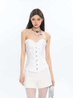 Embrace an air of sophistication with this Corset Top with Feather Detail and Tulle Peplum, a daring fusion of structure and whimsy. Crafted from a high-quality blend, this top features meticulous attention to detail, from the ornate feather accents to the voluminous tulle peplum. The conventional thickness ensures comfort without sacrificing the chic silhouette. Elevate your evening wear or make a statement at an artful social gathering by pairing this top with sleek trousers or a fitted skirt. Elegant Summer Lace Corset, White Lace Overbust Corset, Elegant Spring Lace Corset, Elegant Corset Dress For Costume Party, Elegant Lace Corset, Gothic Corset For Spring, Feminine Wedding Corset With Boned Bodice, Formal Lace Corset, Elegant Spring Party Corset