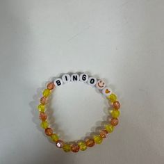 a beaded bracelet with the word bingo written on it