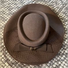 Stunning 100% Wool Hat From 1940s. Still Has The Tag On It. Features Beautiful Bow Detail And Mesh Accent. Also Has Elastic Chin Band To Hold It On. Perfect For A Tea Party Or Derby. No Size Listed Inside Space Measures 7.5” Length X 6.5” Width Vintage Style Fitted Beige Fedora, Vintage Fitted Beige Fedora, Fitted Vintage Beige Fedora, Fitted Beige Vintage Fedora, Vintage Beige Fedora Felt Hat, Vintage Fitted Beige Felt Hat, Fitted Retro Cream Hat, Vintage Wool Cloche Hat, Retro Fitted Cream Hat