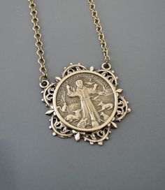 "Vintage Jewelry - Vintage Necklace - Saint Francis necklace - Brass Necklace - Religious jewelry - Catholic necklace - handmade jewelry This is such a beautiful vintage necklace. Vintage brass highly detailed image of St. Francis surrounded by animals. Exquisite detail with a rich patina. The solid brass pendant hangs from a beautiful vintage ladder chain. Chloe says, Wear it and feel fabulous!\" The pendant is 1 1/2\" long. You can choose the necklace length you would like at checkout. Thanks Victorian Antique Silver Nickel-free Necklace, Handmade Vintage Antique Silver Jewelry, Handmade Vintage Jewelry In Antique Silver, Antique Personalized Jewelry Collectible, Antique Finish Medallion Necklace Gift, Antique Finish Medallion Necklace As Gift, Vintage Personalized Jewelry For Collectors, Handmade Vintage Jewelry With Round Pendant, Nickel Free Antique Silver Necklace For Anniversary