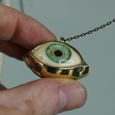 Green Big Eye Pendant, Evil Eye Talisman Pendant, Glass Green Eye Necklace, Evil Eye Necklace, Eye Jewelry, Gift Idea, Handmade Eye Jewelry My eye designs can be made specifically for your eyes, you need to take a beautiful iris photo for us. Then we can customize it for you. You can also add or remove blood details to our eye designs. You can write this in the order notes. Please send me a message after ordering. I can do as you wish. A quasi-universal symbol of protection, the evil eye is refe Brass Evil Eye Jewelry For Gifts, Evil Eye Brass Jewelry As A Gift, Brass Evil Eye Jewelry As A Gift, Handmade Symbolic Green Necklace, Unique Good Luck Pendant Necklace, Eye-shaped Amulet Necklace As Gift, Amulet Eye Necklace Gift, Symbolic Eye-shaped Jewelry Gift, Handmade Vintage Jewelry For Good Luck