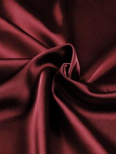 Indulge in the luxurious feel of this 58"/60" wide (147/152 cm) Silk Skin Duchess fabric, also known as Peau de Soie. Its dull satin finish and lightweight drape make it a perfect choice for creating elegant bridesmaid dresses, formal gowns, or any special occasion attire. With a subtle sheen and smooth texture, this high-quality silk fabric offers a sophisticated look and feel. Whether you're a professional dressmaker or an avid sewing enthusiast, this versatile material will elevate your projects with its timeless beauty and exceptional craftsmanship. Elevate your sewing experience and create stunning garments that will turn heads with this premium Silk Skin Duchess fabric. Luxurious Fabric: Crafted from exquisite peau de soie silk, this fabric offers a dull satin finish and a smooth, su Matte Satin Dress, Luxury Solid Satin Tie, Deep Red Fabric, Satin Aesthetic, Duchess Fabric, Satin Colors, Red Satin Fabric, Bridesmaid Dresses Formal, Burgundy Fabric