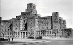 an old photo of a large building with many windows