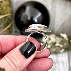 Big Dendritic Agate Crystal Statement Ring in Sterling Silver - Designed by FOXLARK Collection Adjusts to size 6,7,8,9, or 10 Photos are an example. Each stone will be different and each ring handcrafted please allow for differences. Ring length approximately 1.75" Ring is sterling silver and adjustable. Adjustable band is thick sterling silver and adjustable part is hidden under the stone. You can easily adjust the size from roughly size 6-10 yourself. We do recommend you adjust it and leave it Unique White Cabochon Moonstone Ring, White Moonstone Ring With Si Clarity, Adjustable White Rings With Natural Stones, Unique Adjustable White Opal Ring, White Open Ring Spiritual Style, White Spiritual Crystal Open Ring, Spiritual White Crystal Open Ring, White Agate Cabochon Jewelry, Spiritual White Rings With Natural Stones