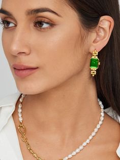 Embrace the allure of our Drop Emerald Green Earrings, meticulously crafted from eco-conscious gold vermeil. Featuring a rectangular face reminiscent of a vintage watch, these earrings showcase an emerald green hue exuding elegance and class. The unique design and rich color make them an undeniable standout, perfect for infusing any outfit with a touch of luxury. Pair them with a minimalist outfit for maximum impact.r maximum impact.r maximum impact. Details Recycled Silver: 18ct gold vermeil Ge Timeless Rectangular Pendant Jewelry, Elegant Rectangular Emerald Earrings For May Birthstone, Elegant Rectangular May Birthstone Earrings, Formal Rectangular Earrings With May Birthstone, Rectangular Fine Jewelry For Evening, Rectangular Gemstone Earrings For May Birthstone, Timeless Rectangular Gemstone Jewelry, Luxury Rectangular Gemstone Earrings, Timeless Yellow Gold Jewelry With Rectangular Stone