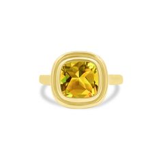 a yellow gold ring with an oval cut stone in the center and a square band around it