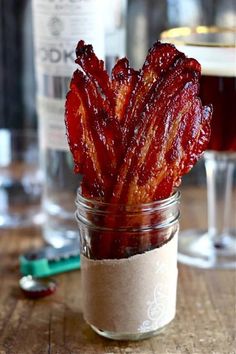 bacon sticks sitting in a jar on a table