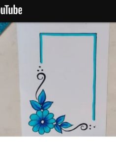 an image of a blue flower on white paper