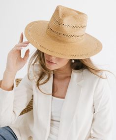 A modern approach to a classic fedora style, featuring delicate venting details + made of fine paper straw, intricately woven for an elevated yet effortless look. Elegant Wide Brim Toquilla Straw Fedora, Elegant Natural Panama Hat In Fedora Style, Elegant Natural Panama Fedora Hat, Elegant Fedora With Curved Brim For Vacation, Elegant Natural Fedora Hats, Elegant Toquilla Straw Fedora For Spring, Elegant Toquilla Straw Fedora For Vacation, Elegant Natural Fedora With Short Brim, Elegant Brimmed Natural Fedora