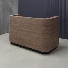 a wooden box sitting on top of a white counter next to a blue and gray wall