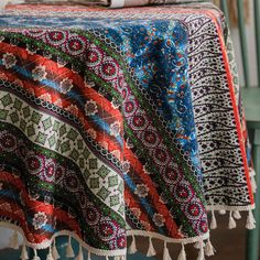 a table covered with a multicolored cloth