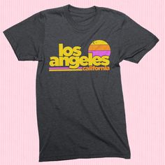 Free Shipping!! Part of our Radical States series, the Los Angeles Sunset shirt is a tribute to old school LA. A retro style and vintage inspired graphic tee printed on a very comfortable, nicely fit shirt. Heather Dark Grey vintage style tee. Men's / Women's / Unisex We use shirts and tanks from companies dedicated to ethical standards of conduct. They are child labor free and sweat shop free. The printing uses inks that are water based and eco-friendly. View our full store: https://www.etsy.co 90s Graphic Tees Vintage, Surf California, Los Angeles Sunset, Retro Shirt Design, Express Outfits, Sunset Shirt, La Style, California Shirt, Beach Vintage