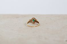 Stunning Vintage 1970s 14K gold Emerald ring 8 diamonds surround large prong set marquise Emerald unmarked - tested 14k Great vintage condition - slight tarnish on gold needs a good cleaning Size 9 Heirloom Marquise Emerald Ring In 14k Gold, Vintage Marquise Gemstone Cluster Ring, Vintage Marquise Jewelry With Prong Setting, Vintage Marquise Emerald Ring For Formal Occasions, Marquise Emerald Ring In 14k Gold, 14k Gold Marquise Cut Emerald Ring, Marquise Emerald Ring In 14k Gold With Prong Setting, 14k Gold Marquise Emerald Ring With Prong Setting, Vintage 14k Gold Marquise Cut Jewelry