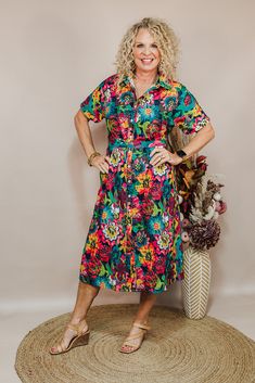 Dresses are a girl's best friend! The Vanessa Dress is a floral button-down midi dress in a floral print with a tie around the waist. Pair with heels or sneaker for whatever look your going for! Available in Sizes: X-Small, Small, Medium, Large, X-Large, 2X Michaelle is wearing a X-Small Fabric: 100% Polyester Fit: You Can Usually Size Down In Layerz Clothing Brand: Layerz Clothing Spring Printed Button-up Dresses, Casual Multicolor Tropical Print Midi Dress, Casual Multicolor Midi Dress With Tropical Print, Spring Floral Print Shirt Dress For Beach, Spring Tropical Print Midi Floral Dress, Floral Print Shirt Dress For Spring Beach Outings, Floral Print Shirt Dress For Spring Beach, Casual Floral Print Button-up Shirt Dress, Mid-length Floral Print Dress For Casual Occasions