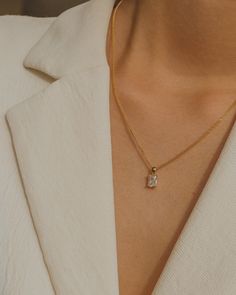 Simple, graceful, and minimalistic, this piece features a rectangular clear crystal CZ stone suspended on the daintiest gold chain. Made with 100% gold-filled materials, she is truly an everyday necklace that you can wear whenever and wherever your heard desires — even in the shower. …………………………………. D E T A I L S • Pendant measures 5 x 13 mm • Tarnish-resistant, waterproof, safe for sensitive skin • 1.5mm width curb chain with spring clasp • 100% 18k gold-filled Elegant Everyday Charm Necklaces, Delicate Everyday Necklace With Initial Pendant, Timeless Rectangular Pendant Jewelry As Gift, Delicate White Diamond Necklace For Everyday, Timeless Rectangular Pendant Jewelry Gift, Timeless Rectangular Pendant Jewelry, Everyday Jewelry With Delicate Square Pendant Chain, Elegant Charm Necklace With Delicate Chain For Everyday, Everyday Rectangular Pendant Necklace With Delicate Chain