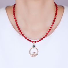 Doris Red Coral Gemstone Bead Necklace DESIGN DETAILS:This beautiful natural stone bead necklace is made with 5mm red coral gemstone beads. With an abstract coral reef design, the pendant features blue, ruby red, peridot green and white cubic zirconia crystals. There are 2 kinds of gold plating on the pendant. The necklace clasps are gold filled metal.PENDANT NECKLACE DETAILS:- PENDANT LENGTH: 1.75 inches | WIDTH: 1 inches- CHAIN LENGTH: 16 inches + 2 inches extension- CHAIN CLOSURE: Lobster Cla Coral Reef Design, Beaded Necklace Designs, Coral Gemstone, Peridot Green, Necklace Clasps, Stone Beaded Necklace, Gemstone Beaded Necklace, Necklace Design, Metal Pendant