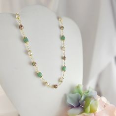 "This handcrafted green aventurine beaded necklace is a unique piece that makes a memorable green gemstone jewelry gift for her. It is sold as a 3-piece set of 3-inch long earrings, an adjustable 18-20 inch necklace and a matching 6.5-8 inch bracelet. The earrings are made with 14K gold-filled 20-gauge French earwires, and the necklace and bracelet are made with our anti-tarnish treated gold wire, chain and lobster clasps.  The beads used in this elaborate design are 8mm and 12mm vintage cloisonne beads, genuine 8x13mm green aventurine oval beads and 8mm white shell pearls. Thank you for visiting Gemsicles!  - Shop Gemsicles, an Etsy boutique with hundreds of sparkly items for weddings, gifts and just because. Our original jewelry designs feature gemstones, Discontinued Designer crystals, Green Jade Necklace, Green Aventurine Necklace, Weddings Gifts, Cloisonne Earrings, Original Jewelry Design, Etsy Boutique, 20 Inch Necklace, Aventurine Necklace, Necklace Green