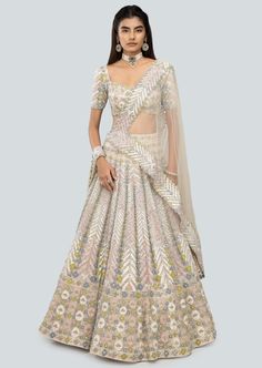 Alabaster applique and embellished heavy kali mirror work net lehenga with broad lehenga border, blouse and broad border net dupatta. Off White Floor-length Set With Sheer Dupatta, Beige Sets For Navratri Reception, Beige Sets For Reception During Navratri, White Kundan Lehenga With Cutdana, Cream Semi-stitched Lehenga For Reception, Off White Lehenga For Reception And Navratri, Festive Floor-length Beige Lehenga, Off White Lehenga With Cutdana In Traditional Drape, Off White Cutdana Lehenga With Traditional Drape