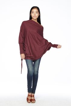 "🚚..ALL ORDERS ARE SHIPPED VIA DHL EXPRESS MAIL This batwing tunic is a very \"cool\" addition to any wardrobe! With a unique drawstrings on bottom hem of tunic provide plenty of options for changing the look. Cowl neckline, batwing sleeves with wide cuffed and oversized side pocket; can be worn layered over leggings, pants, or skirt for even more dramatic effects. * Pull-on style * Cowl neckline * Dropped shoulders * Long sleeves with wide ribbed cuff * Oversize side pocket * Asymmetrical hem Oversized Asymmetrical Spring Sweater, Oversized Asymmetrical Sweater For Spring, Winter Plain Top With Asymmetrical Hem, Red Oversized Chic Tops, Fall Tops With Asymmetrical Hem For Layering, Fall Tops For Layering With Asymmetrical Hem, Fall Layering Tops With Asymmetrical Hem, Lagenlook Long Sleeve Blouse For Fall, Slouchy Top For Fall