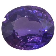 an oval cut tanzante stone with purple highlights