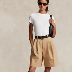 Belt Not Included>Dressy Causal Tan Shorts High Waisted Come Right Above The Knee. Made With A Blend Of Italian Cotton Twill And Wool, These Pleated-Front Shorts Are Designed With A Relaxed Silhouette And An Elongated Inseam. Mid-Rise. Relaxed Fit. Intended To Hit Above The Knee. Us Size 8 Has A 12" Rise And A 32" Leg Opening. All Sizes Have An 8.5" Inseam. Belt Loops. Zip Fly With A Buttoned Closure. Side On-Seam Pockets. Two Back Buttoned Welt Pockets. Pleated Front Waist. Back Waist Darts. 70 Womens Tailored Shorts, Classic Fitted Shorts For Day Out, Classic Fitted Shorts For A Day Out, Twill Outfit, Shorts Business Casual, Ralph Lauren Shorts Women, Structured Shorts, Greece Vacation Outfit, Italy Clothes