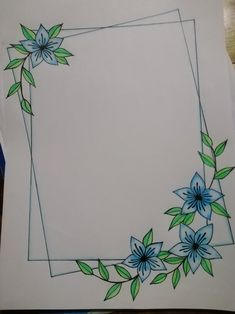 a drawing of blue flowers and green leaves on white paper with an empty square in the middle