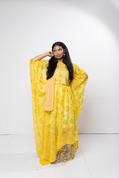 The Dirac is a beautiful bright yellow color with gold floral designs. It is a three piece set including a matching tan garbasar and yellow gogorad with gold embroidery . The set is tailored, free size. Pink Dirac, Somali Wedding Dirac Green, Luxury Yellow Floor-length Dupatta, Purple Dirac Somali, Luxury Yellow Floor-length Kaftan, Gold Embroidery, Free Size, Yellow Color, Festival Season