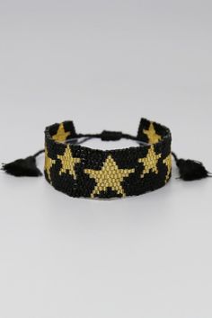 Adjustable star beaded bracelet. Black and gold, Adjustable Gold Star Bracelet, Adjustable Gold Beaded Wristband, Adjustable Black Friendship Bracelet With Colorful Beads, Black Bracelets With Tiny Beads For Party, Bohemian Black Beaded Bracelets With Gold Beads, Gold Beaded Stretch Bracelet For Festivals, Black Bracelet With Gold Beads, Trendy Black Bracelets With Colorful Beads, Bohemian Adjustable Bracelet With Star Charm