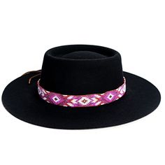 Price includes a Brigitte Sambboho hat & a Melrose hatband. Save 10% with this bundle. Select hat size. Hatband is one size fits all. Hatband is removable. The fanciest hat you will ever wear. Sambboho's Brigitte black hat is a dipped crown boater design with a custom trimmed genuine velvet black band. A structured and stiff short-brimmed boater style. Use to make an impression! Dipped crown oval boater hat in Black Trimmed with genuine Velvet Black Band Hat material: 100% soft Brazilian woo Bohemian Handmade Black Hat Bands, Custom Handmade Black Hat Bands, Black Beaded Curved Brim Hat, Black Brimmed Hat Band, Adjustable Beaded Wide-brim Fedora, Boater Hat, Beaded Hat, Native American Beaded Earrings, Black Hat