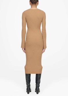 Designed by Anine Bing. A crewneck midi dress featuring long fitted sleeves that flare out slightly into a bell shape at each cuff. The Sia Dress is made from a luxurious ribbed-knit fabrication infused with a touch of comfort stretch in neutral camel. The Sia Dress is cut for a fitted shape that relaxes slightly from the hips through its midi-length hem. Take your true size. Return Policy Camel Fabric, Fitted Sleeves, Anine Bing, Wide Sleeves, Everyday Wardrobe, Global Fashion, Modern Woman, Midi Length, Fashion Brand