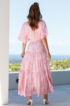 Length from shoulder to hem of size S: 141cm. Pink maxi dress. Non-lined. Cold hand wash only. Model is a standard XS and is wearing size XS. True to size. Lightweight, non-stretchy woven farbic. Shirred, stretchy waist. No zipper. Print placement may vary. Rayon. Be the blooming rose in someone else's bouquet this weekend wearing our Savage Love Maxi Dress! Billowy and perfect for warm-weather, we're low key obsessed with its feminine cinched waist, vintage floral print, and tiered ruffle skirt.  Pair yours with woven slides and a straw sunhat! Savage Love, Tiered Ruffle Skirt, Pink Maxi, Blooming Rose, Vintage Floral Print, Print Placement, Pink Maxi Dress, Weekend Wear, Ruffle Skirt