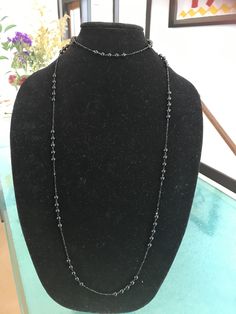 "This stunning necklace modeled after one wore by Lady Mary in the Downton Abbey series manages to be impossibly delicate yet incredibly dramatic at the same time. It is made from 50\" of tiny, 2mm glittering faceted black spinel beads interspersed with sections of smooth 6mm polished black onyx. This is a VERY long necklace in the style of that day. It can be worn as one long necklace (if you're tall or going for the true '20s look) but it's also meant to be looped again over the head, as a cho Elegant Black Crystal Necklace With Beaded Chain, Elegant Single Strand Chain Necklace For Party, Elegant Handmade Black Long Necklace, Luxury Single Strand Necklace For Parties, Elegant Beaded Black Spinel Jewelry, Long Beaded Chain Necklace For Evening, Evening Long Necklace With Beaded Chain, Elegant Black Beaded Evening Jewelry, Elegant Black Beaded Jewelry For Evening