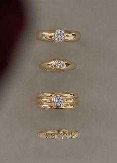 three different types of wedding rings with diamond stones on each one and the other side