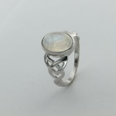 These is a beautiful pair of Sterling Silver Ring with a Rainbow Moonstone Gemstone. The ring are made out of solid 925 Silver and there is no nickel or other substances causing most allergies. This makes the ring hypo allergenic. Size of the Moonstone 1.2 x 0.8 cm or 0.47 x 0.31 inch You will receive the item in a gift box - perfect to surprise someone or yourself. Usually we ship on the same day we receive the payment for the order. We want you to be happy with your purchase. If you do not lik Adjustable Round Crystal Ring With Stone Setting, Mystical Cabochon Ring For Anniversary, Mystical Anniversary Ring With Cabochon, Silver Moonstone Crystal Ring In Moon Shape, Adjustable Moon Shaped Gemstone Jewelry, Sterling Silver Polished Moonstone Ring As Gift, Adjustable Moon-shaped Gemstone Jewelry, Sterling Silver Moonstone Ring With Polished Finish, Fine Jewelry Silver Hallmarked Moonstone Ring