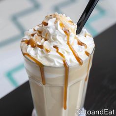 a drink with whipped cream and caramel drizzle