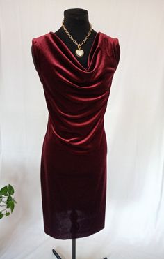 Velvet dress. Great for Parties or business related events. Knee length or below the knee dress. Fitted waist. Please provide your measurements for a custom fit. Formal Draped Velvet Dress, Elegant Draped Velvet Dress, Elegant Ruched Velvet Dress For Formal Occasions, Fitted Cowl Neck Midi Dress, Elegant Sleeveless Velvet Midi Dress, Fitted Cowl Neck Midi Dress For Formal Occasions, Fitted Sleeveless Velvet Dress, Elegant Knee-length Velvet Dress For Formal Occasions, Sleeveless Velvet Midi Cocktail Dress