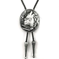 Embrace the untamed beauty of the American Southwest with our Howling Wolf Bolo Tie, a traditional Western accessory that adds a stylish touch to any cowboy look. Crafted with braided leather cords and zinc alloy accents, this 38" (96cm) bolo tie features a pendant measuring 1.6" (4cm) x 2" (5cm), adorned with a striking howling wolf head.  Designed for both style and comfort, this bolo tie features a slider clasp for easy adjustment, ensuring a perfect fit every time. Whether you're exploring t Western Style Jewelry With Adjustable Chain, Western Jewelry With Adjustable Chain, Bohemian Lariat Bolo Ties For Festivals, Western Lariat Jewelry For Festival, Western Style Silver Necklace With Adjustable Length, Western Silver Necklace With Adjustable Length, Adjustable Concho Necklaces For Festival, Bohemian Hand Tooled Jewelry For Rodeo, Adjustable Western Necklaces For Rodeo