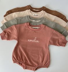 These sweatshirt bodysuits are ridiculously soft and have the perfect stretch. They're designed to have an oversized fit, keeping your little one cute and cozy! Runs true to size, but always size up if you're on the fence with sizing, or to achieve that extra oversized look! They're made to order using a commercial quality design process and made to last wash after wash without peeling, cracking or fading. Also available plain if you don't want a name added. CPSIA compliant PROCESSING & SHIPPING Casual Long Sleeve Onesie With Relaxed Fit, Basic Bodysuit For Loungewear, Comfortable Long Sleeve Cotton Onesie, Casual Fall Bodysuit For Playtime, Cute Relaxed Fit Tops With Ribbed Cuffs, Relaxed Fit Cotton Bodysuit For Loungewear, Cute Solid Color Playwear Bodysuit, Cute Solid Color Bodysuit For Playwear, Cotton Onesie For Loungewear