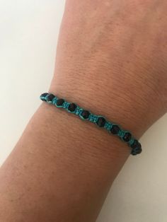 "SPECIAL OFFER!! Buy TWO get ONE for FREE!! of equal or lesser value (please, don't add your free product to your shopping cart or you will be charged for it. Pick 1 product and leave the full name of it in the \"Note to enjoywelrydesign\" Box during checkout.) This is a turquoise macrame bracelet with black crystal beads. Protect yourself from selfishness and negativity with this Kabbalah bracelet. The simplicity of this bracelet make it easy to match. And also very elegant. The bracelet is adj Casual Turquoise Crystal Bracelet For Gift, Adjustable Black Crystal Bracelet With Black Beads, Black Beaded Friendship Jewelry, Black Beads Jewelry For Friendship, Black Beaded Bracelets With Adjustable Cord As Gift, Black Beaded Bracelet With Adjustable Cord For Everyday, Everyday Black Beaded Bracelet With Adjustable Cord, Casual Beaded Bracelets With Black Beads As Gift, Black Beaded Bracelet With Adjustable Cord As Gift