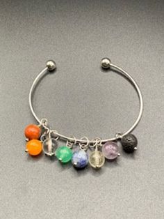 Chakra bead silver bangle bracelet Metal Bracelet With 8mm Beads, Silver Bangle Bracelets With Silver Beads, Silver Bangle Bracelet With Silver Beads, Silver Spacer Beads Bracelet, Silver Beaded Bracelets With Colorful Beads, Metal Bead Bracelet 8mm, Metal Beaded 8mm Bracelet, Metal Beaded Bangle As Gift, Silver Beads Dangle Bracelet For Gift